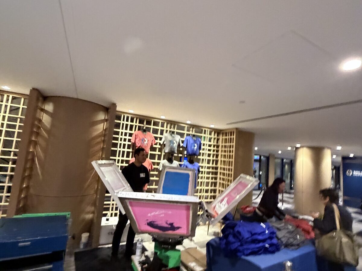 Live personalization station set up in an elegant hotel lobby with finished pieces on display